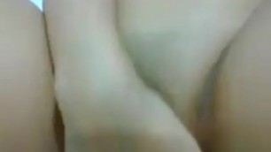 Asian Girl Fingering herself with a Condom